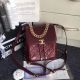 Chanel Grained Calfskin Backpack with Gold-Tone Metal - A57570 Burgundy