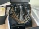 Chanel 22 Handbag in Shiny Calfskin and Gold-Tone Metal - Black and Gold