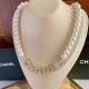 Chanel Necklace with CC Logo and Pearls
