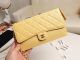 Chanel Classic Lambskin Pouch with Gold-Tone Metal Handle in Yellow