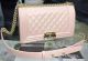 Original Boy Chanel Flap Shoulder Bag in Light Pink A5708, made of high-quality leather with signature Chanel design elements. Perfect for any fashion-forward individual looking to add a touch of luxury to their style.